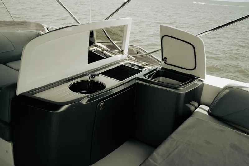 Slide: The Image of Luxury yacht Princess S62, 2020 model, featuring an outdoor kitchenette with sink and storage. - 37