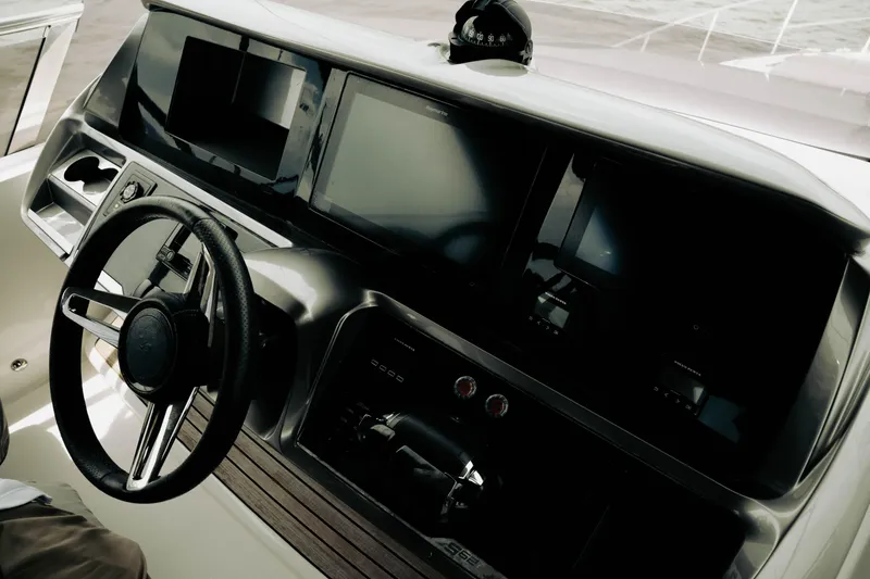 Slide: The Image of Helm of 2020 Princess S62 yacht with modern navigation displays and steering wheel. - 39