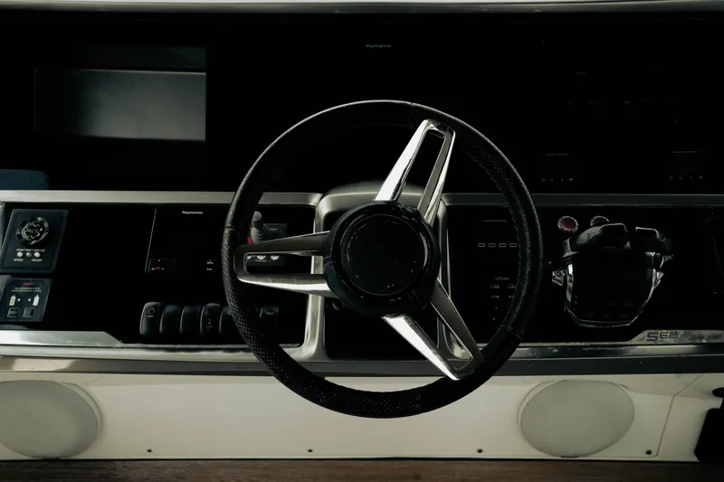 Slide: The Image of Steering wheel and controls of a 2020 Princess S62 yacht cockpit. - 40