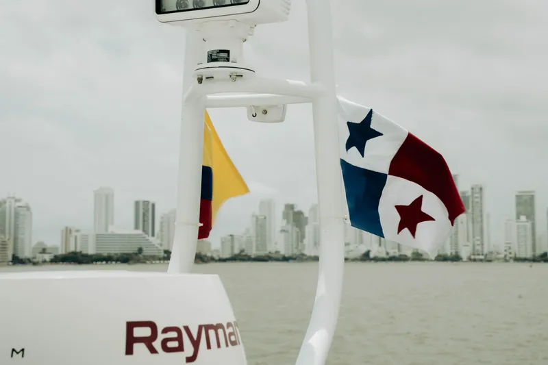 Slide: The Image of Boat with Panama and Colombia flags, city skyline in background, Princess S62, 2020 model. - 44
