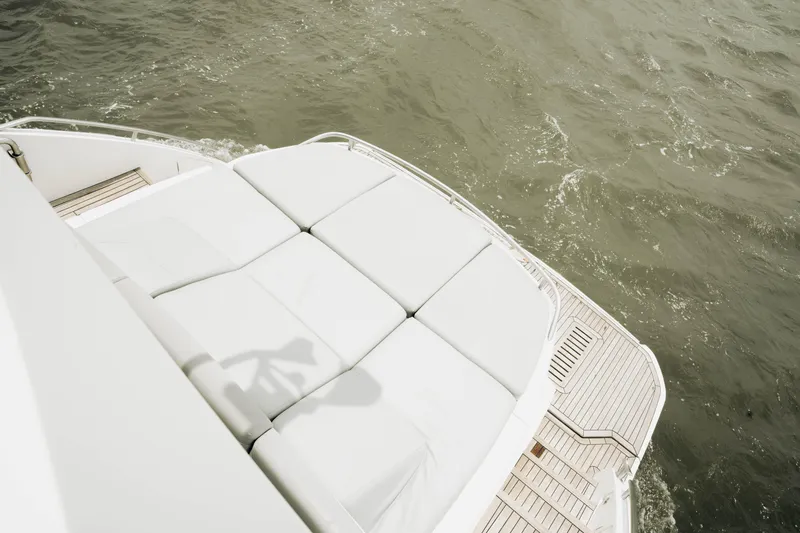 Slide: The Image of Luxury yacht Princess S62, 2020 model, featuring spacious sunbathing deck on calm waters. - 46