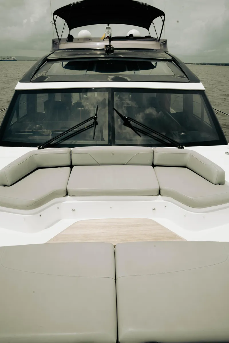 Slide: The Image of 2020 Princess S62 yacht with spacious deck seating and sleek design on calm waters. - 47