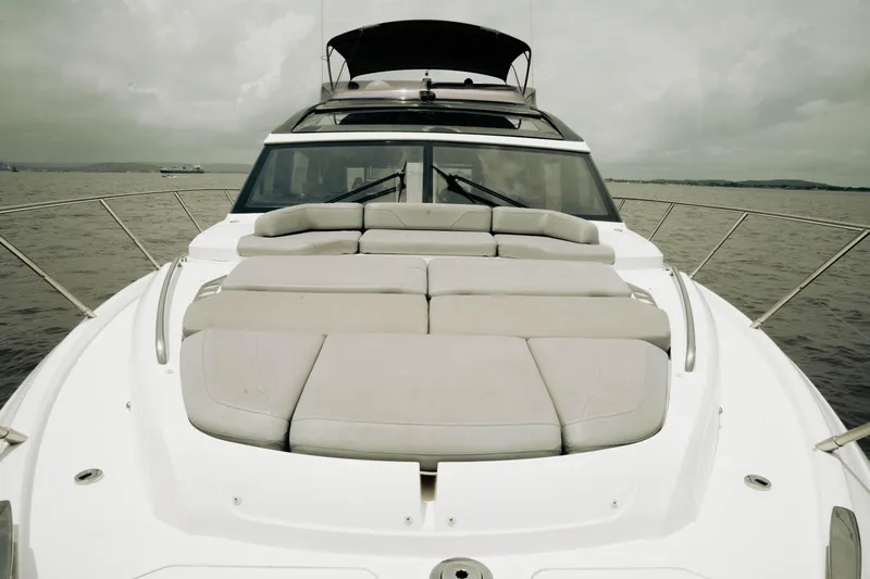 Slide: The Image of Luxury Princess S62 yacht, 2020 model, with spacious sunbathing area on open water. - 48