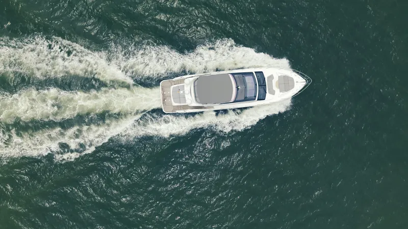 Slide: The Image of Aerial view of 2020 Princess S62 yacht cruising through the ocean. - 5