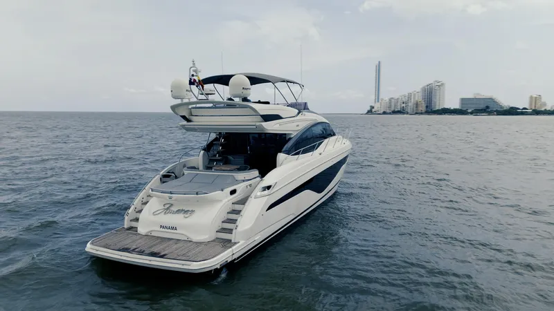 Slide: The Image of Luxury Princess S62 yacht cruising near city skyline, 2020 model. - 7