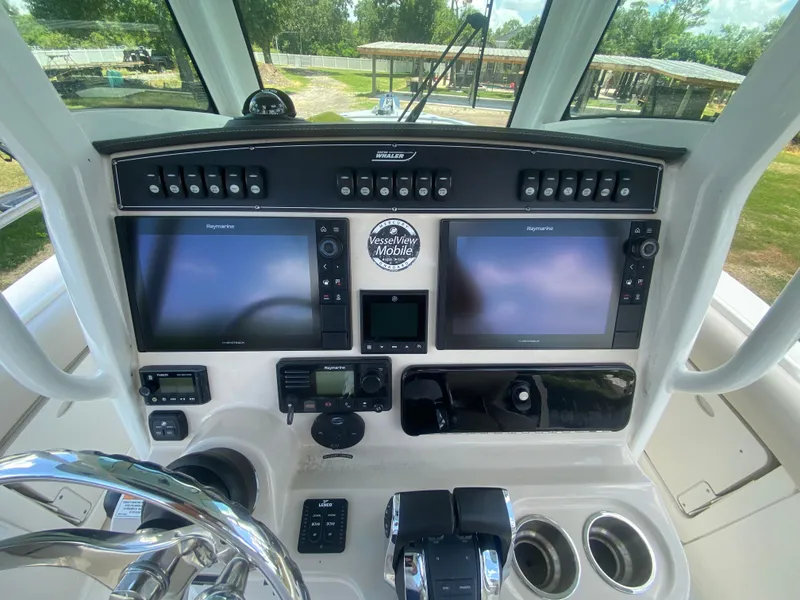 Slide: The Image of 2022 Boston Whaler 250 Outrage helm with dual Raymarine displays and VesselView Mobile. - 13