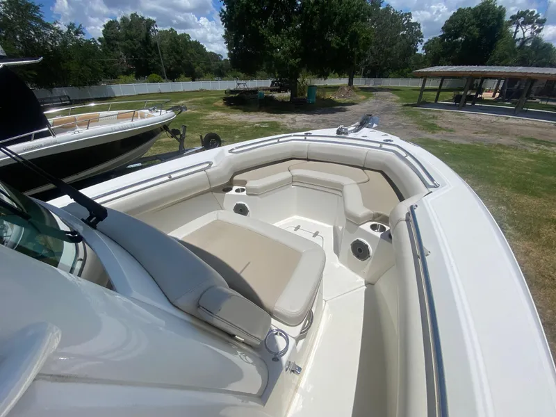 Slide: The Image of 2022 Boston Whaler 250 Outrage boat with spacious seating and sleek design. - 21