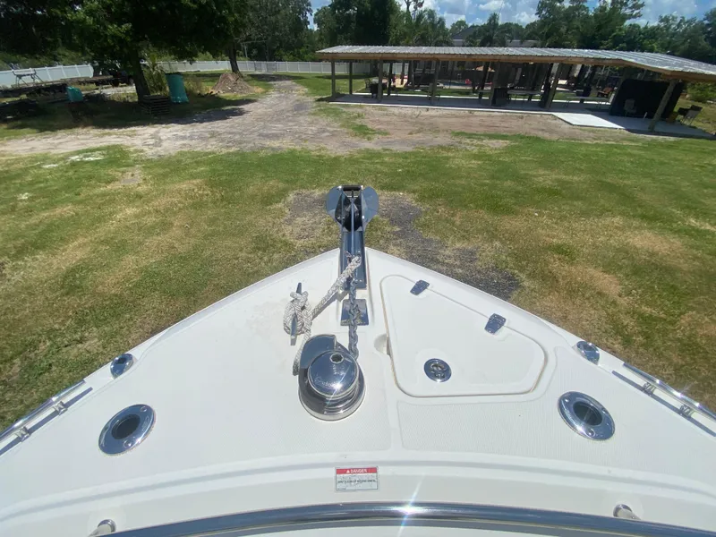 Slide: The Image of Bow view of 2022 Boston Whaler 250 Outrage, showcasing anchor and deck features. - 25