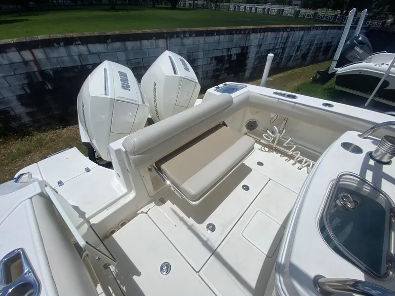 Slide: The Image of 2022 Boston Whaler 250 Outrage boat with dual Mercury engines and spacious seating area. - 9