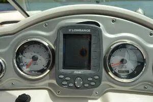 Slide: The Image of Dashboard of a 2011 Sea Ray 240 Sundeck with gauges and Lowrance display. - 16