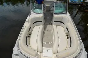 Slide: The Image of 2011 Sea Ray 240 Sundeck boat interior with spacious seating and open deck design. - 8