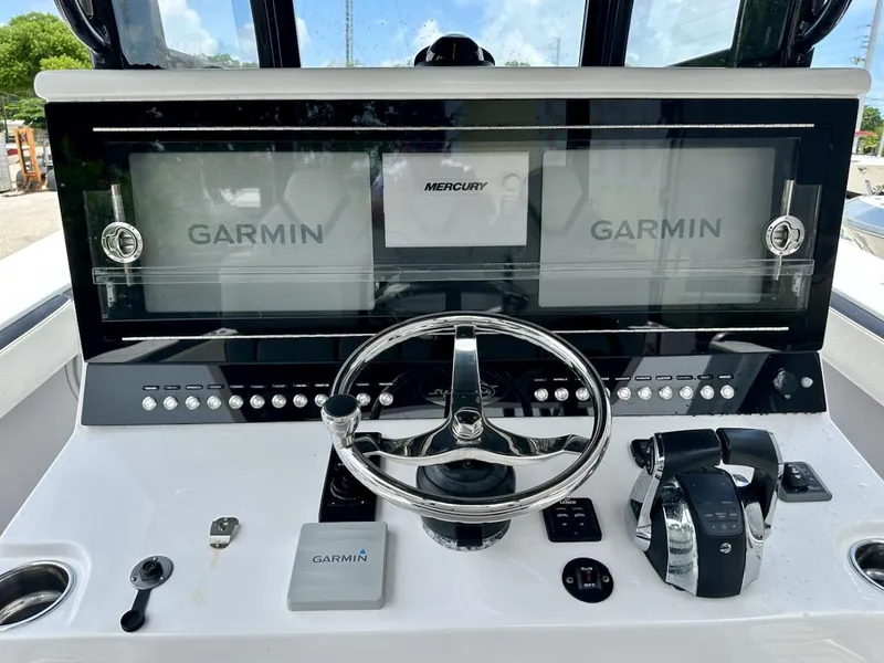 Slide: The Image of Streamline 35CC 2021 boat dashboard with Garmin displays and Mercury controls. - 14
