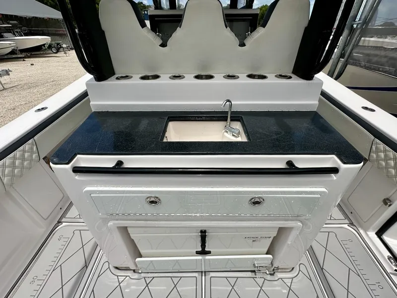Slide: The Image of 2021 Streamline 35CC boat interior with sink and storage compartments. - 18