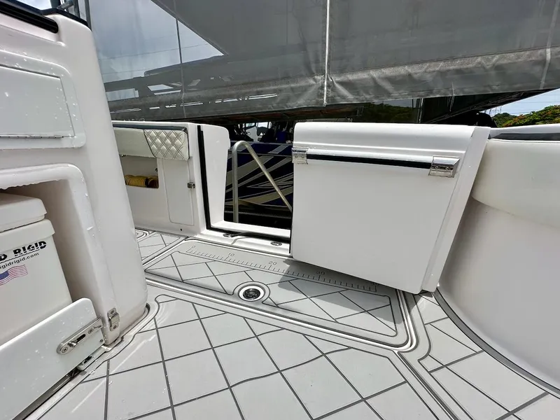 Slide: The Image of 2021 Streamline 35CC boat interior with open storage compartments and non-slip flooring. - 20