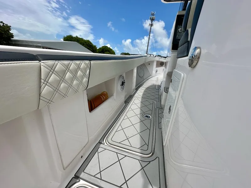 Slide: The Image of 2021 Streamline 35CC boat interior with sleek design and modern features under a blue sky. - 22