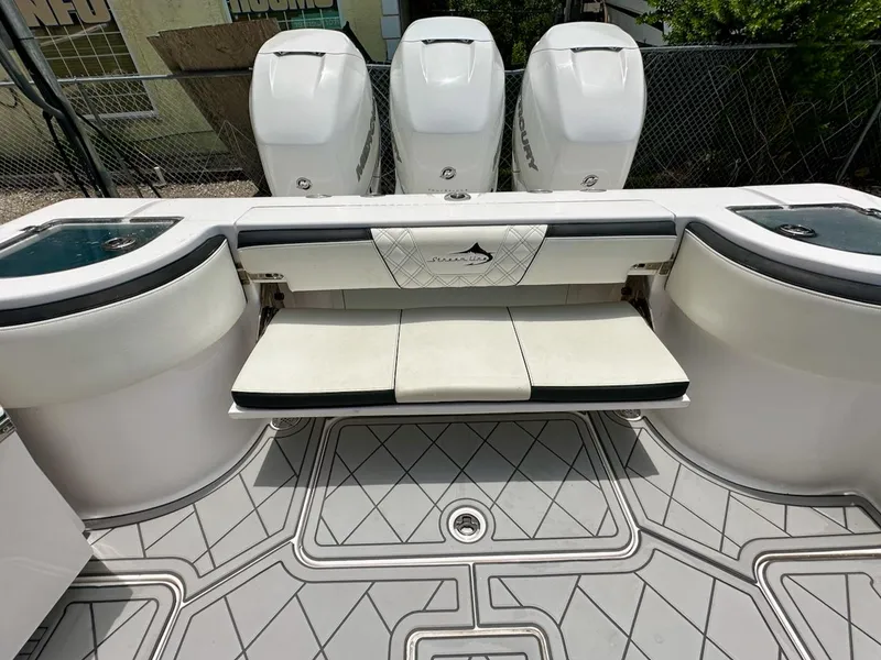 Slide: The Image of 2021 Streamline 35CC boat with triple Mercury engines and cushioned seating. - 27