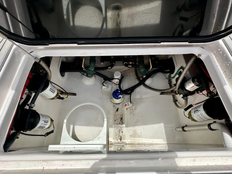 Slide: The Image of Engine compartment of 2021 Streamline 35CC boat, showing fuel filters and hoses. - 28