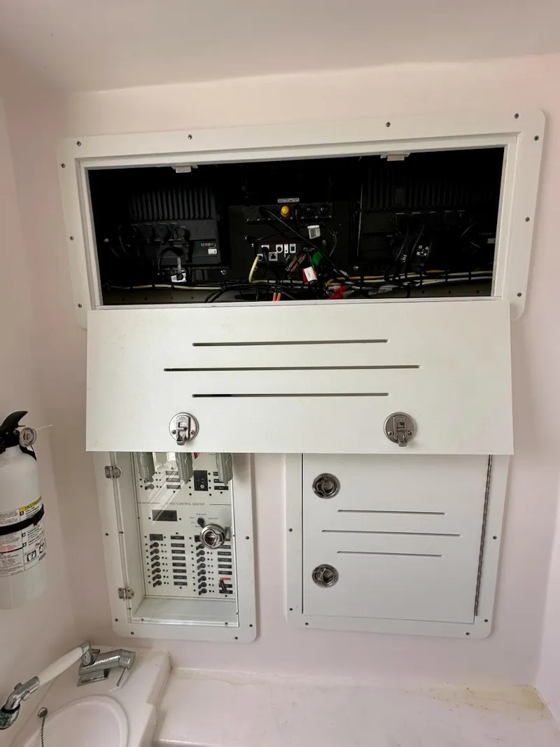 Slide: The Image of Electrical panel and equipment in a 2021 Streamline 35CC boat interior. - 33