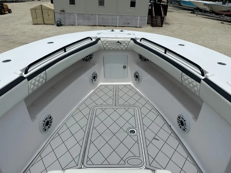 Slide: The Image of 2021 Streamline 35CC boat interior with diamond-patterned flooring and cushioned seating. - 4