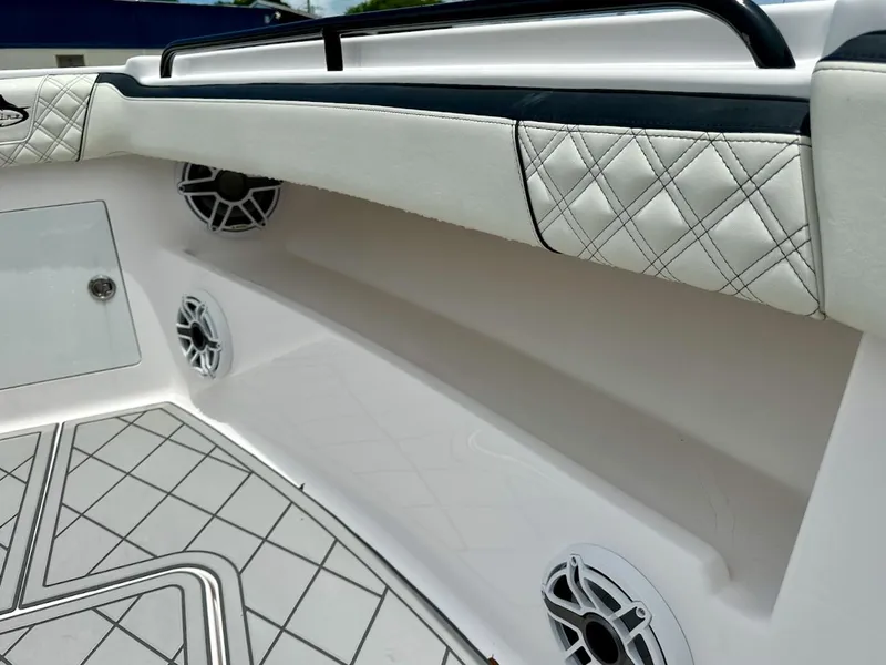 Slide: The Image of Streamline 35CC 2021 boat interior with quilted upholstery and built-in speakers. - 6