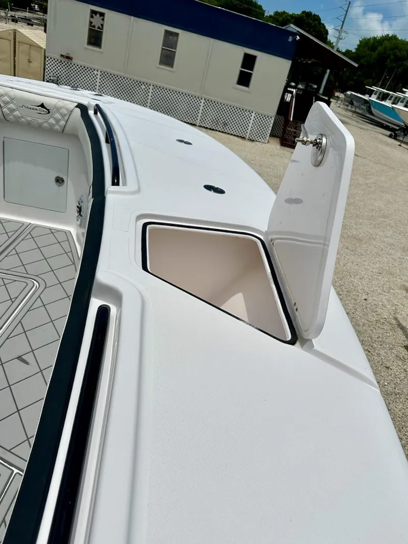 Slide: The Image of 2021 Streamline 35CC boat deck with open storage compartment. - 8
