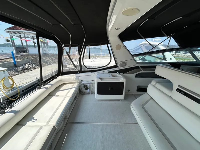 Slide: The Image of Interior of 1993 Sea Ray 440 Sundancer yacht with spacious seating and modern design. - 15