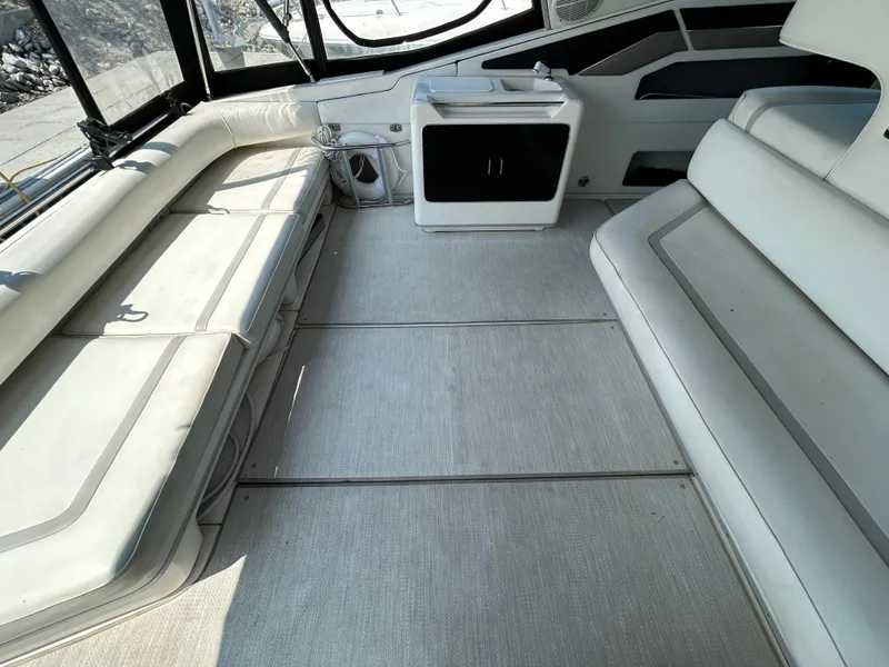 Slide: The Image of Interior of 1993 Sea Ray 440 Sundancer yacht with spacious seating and modern design. - 16