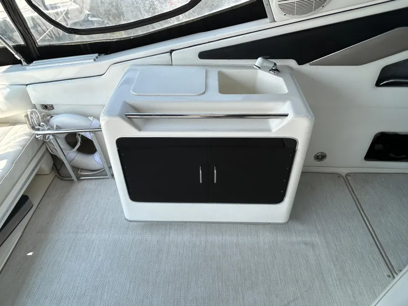 Slide: The Image of White sink and cutting board on 1993 Sea Ray 440 Sundancer boat. - 23