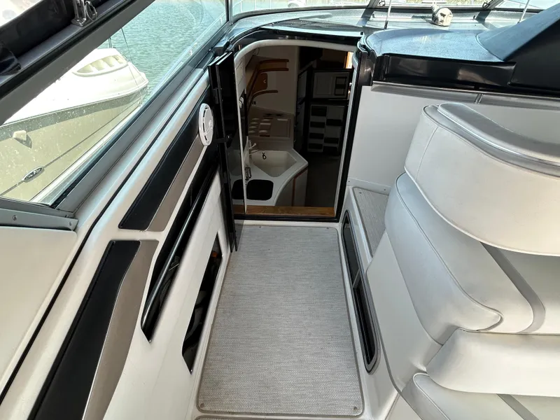 Slide: The Image of 1993 Sea Ray 440 Sundancer yacht interior with helm and cabin view. - 27