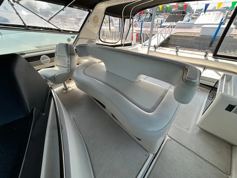 Slide: The Image of 1993 Sea Ray 440 Sundancer helm with Garmin navigation and communication equipment. - 32