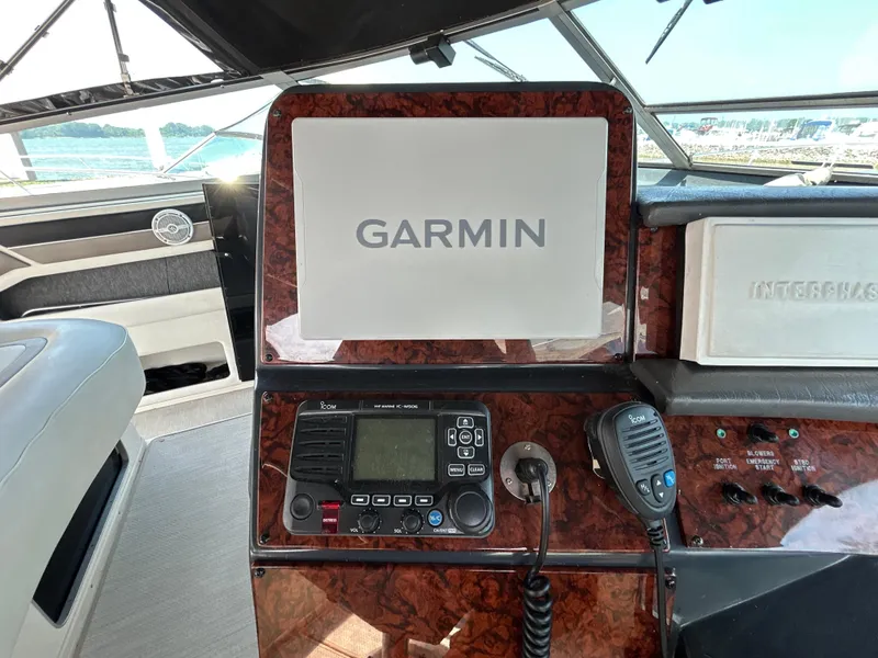 Slide: The Image of 1993 Sea Ray 440 Sundancer systems monitor panel with various pump and engine function indicators. - 37