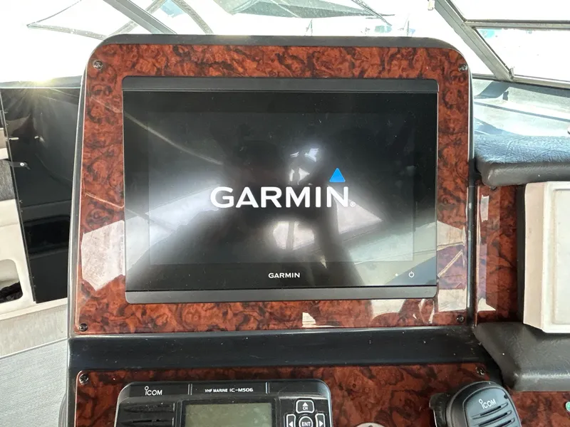 Slide: The Image of 1993 Sea Ray 440 Sundancer interior with kitchen, seating area, and modern amenities. - 38