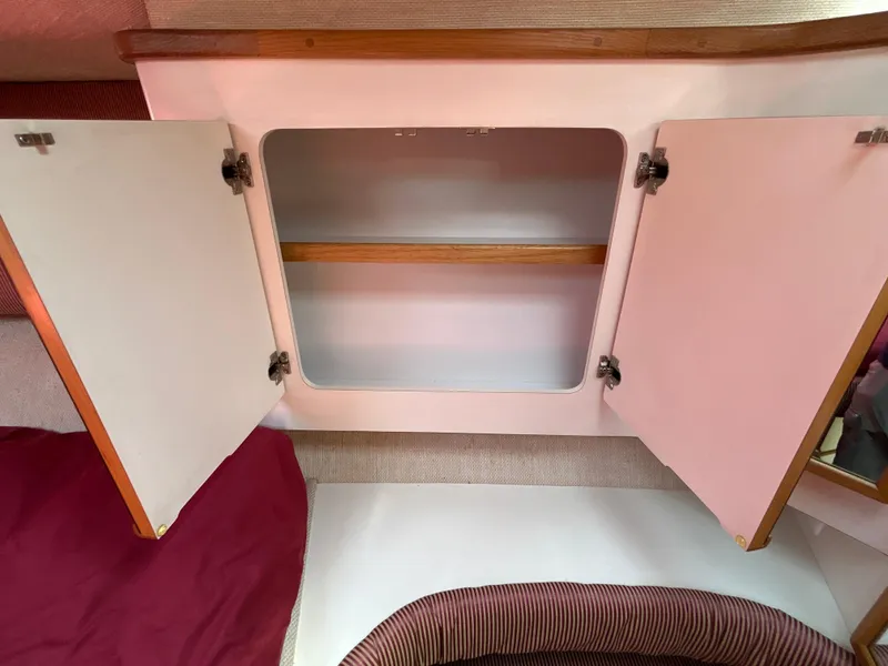 Slide: The Image of Luxurious interior of 1993 Sea Ray 440 Sundancer yacht with plush seating and table. - 64