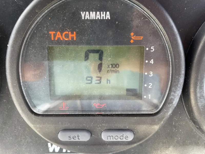 Slide: The Image of Yamaha tachometer displaying 93 hours on a 1999 Boston Whaler Outrage 23 boat. - 13
