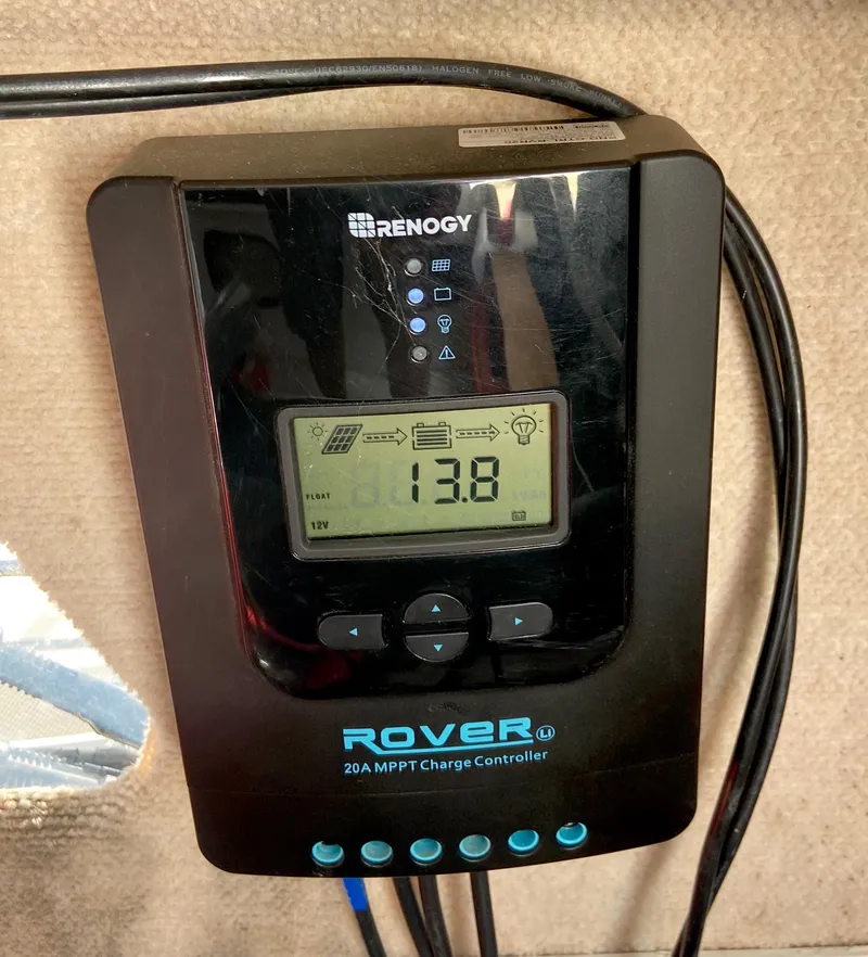 Slide: The Image of Renogy Rover 20A MPPT charge controller displaying 13.8 volts on a Corsair F27, 1990 model. - 18