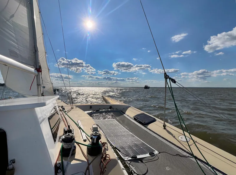 Slide: The Image of Sailing on a 1990 Corsair F27 trimaran under a bright sun and clear sky. - 5