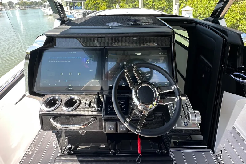 Slide: The Image of 2024 Nor-Tech 400 Supersport dashboard with modern steering and touchscreen controls. - 14