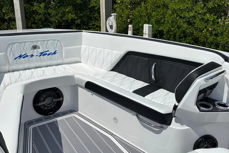 Slide: The Image of 2024 Nor-Tech 400 Supersport interior with luxurious white and black seating, sleek design. - 15