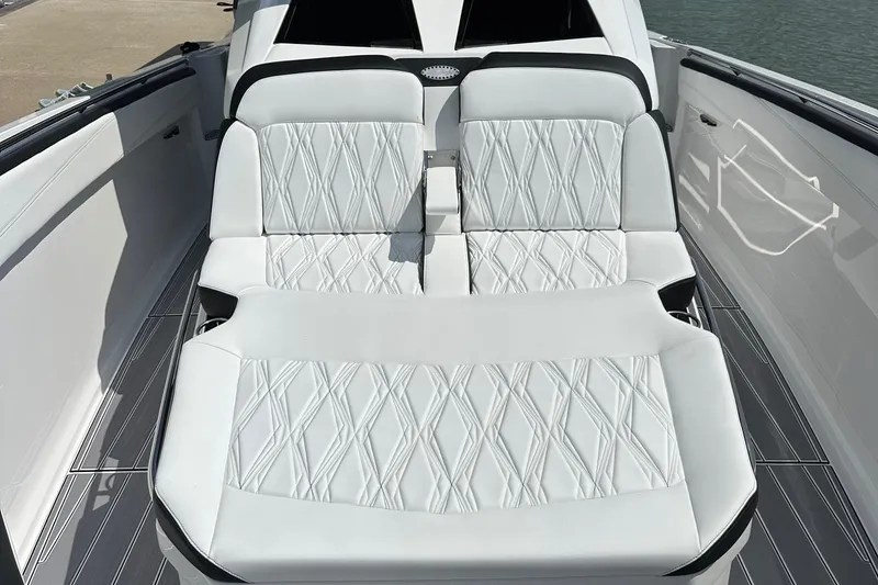 Slide: The Image of 2024 Nor-Tech 400 Supersport boat with luxurious white seating and modern design. - 19