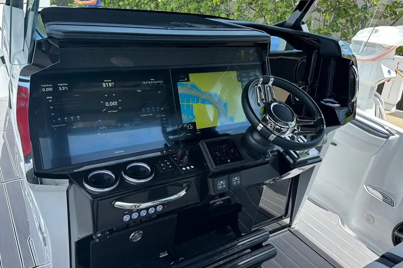 Slide: The Image of 2024 Nor-Tech 400 Supersport dashboard with advanced navigation and control systems. - 24