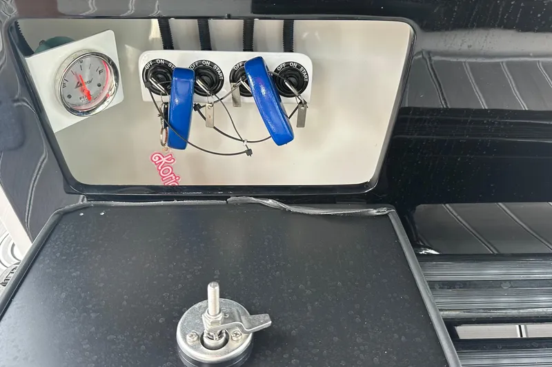 Slide: The Image of Control panel of 2024 Nor-Tech 400 Supersport boat with gauges and switches. - 26