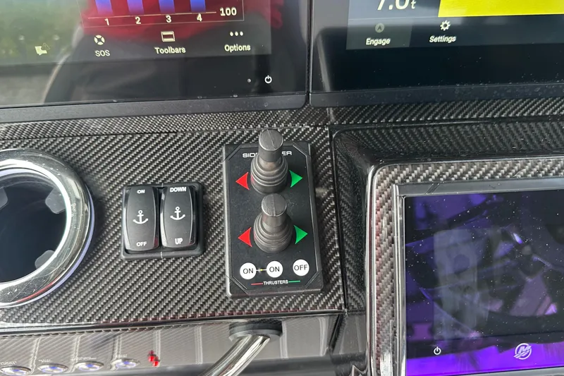 Slide: The Image of Control panel of 2024 Nor-Tech 400 Supersport with carbon fiber finish and digital displays. - 29