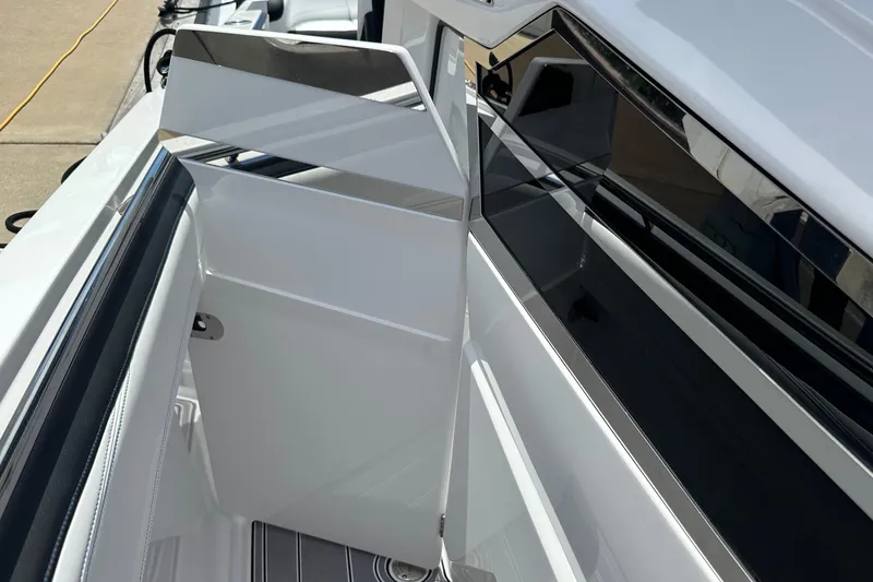 Slide: The Image of 2024 Nor-Tech 400 Supersport boat interior with sleek white and black design elements. - 37