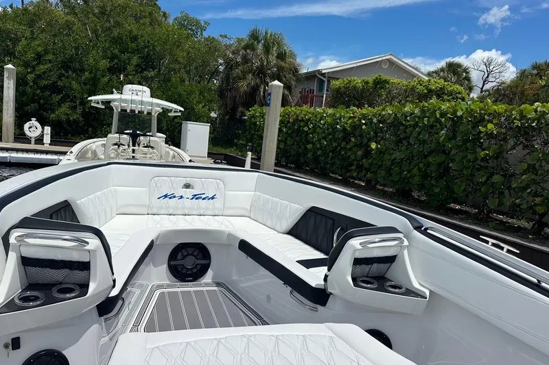 Slide: The Image of 2024 Nor-Tech 400 Supersport boat interior with luxurious seating and cup holders. - 39