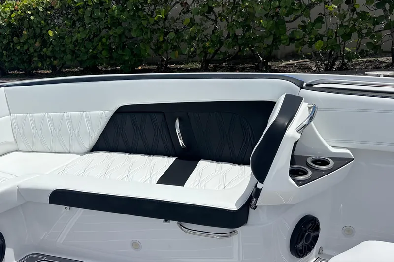 Slide: The Image of 2024 Nor-Tech 400 Supersport boat interior with luxurious white and black seating. - 40