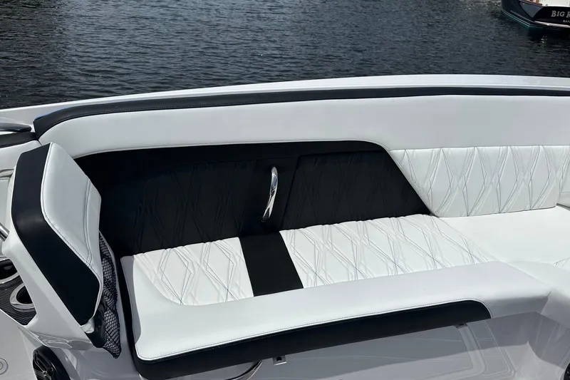 Slide: The Image of 2024 Nor-Tech 400 Supersport boat interior with luxurious white and black seating. - 41