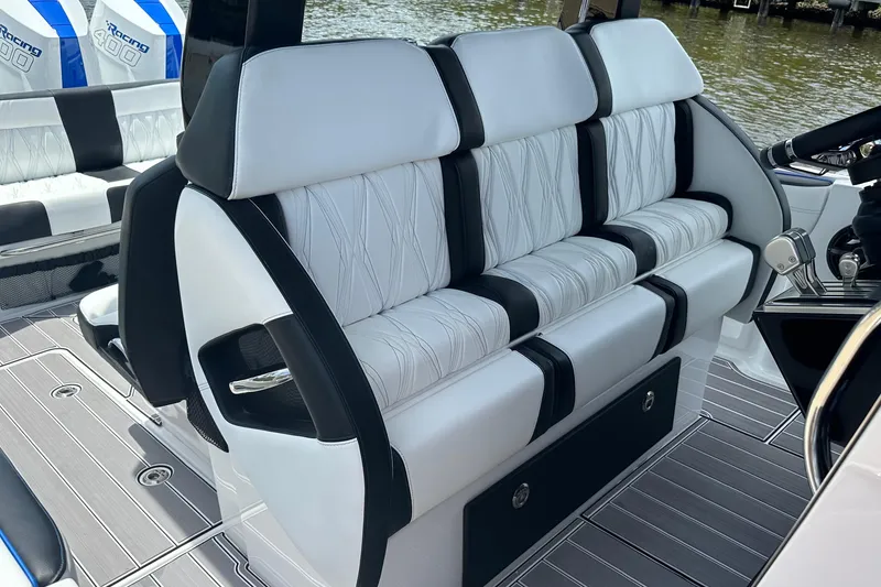 Slide: The Image of 2024 Nor-Tech 400 Supersport boat interior with luxurious seating and modern design. - 48