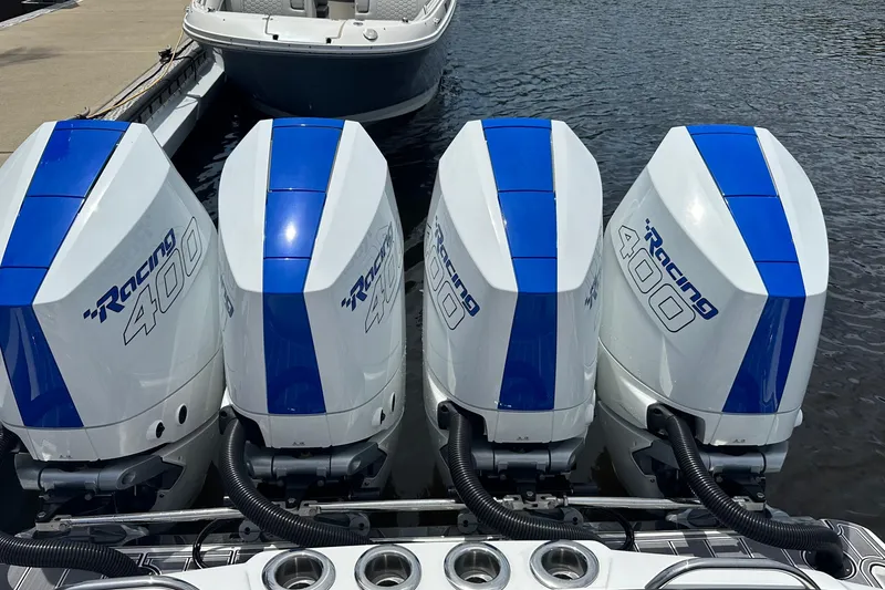 Slide: The Image of Four powerful Racing 400 outboard engines on a 2024 Nor-Tech 400 Supersport boat. - 50