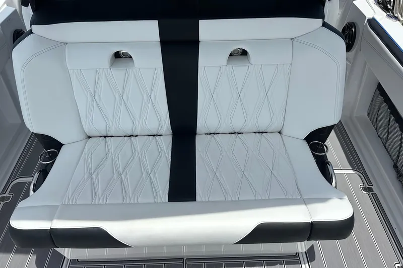 Slide: The Image of Luxurious seating on 2024 Nor-Tech 400 Supersport boat, featuring elegant white upholstery. - 51
