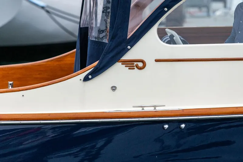 Slide: The Image of 1998 Hinckley Picnic Boat with elegant wood trim and classic design details. - 17